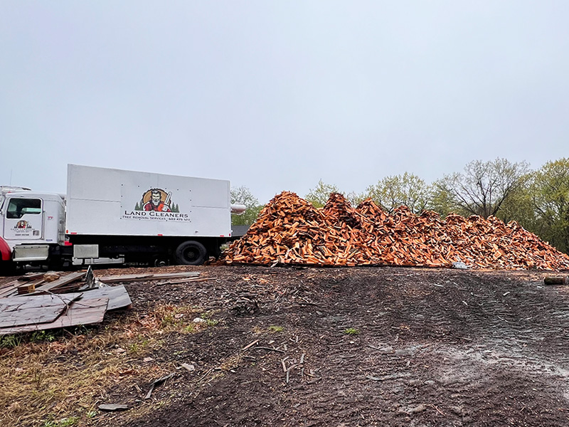 land cleaners firewood pile